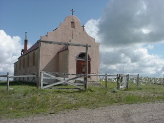 A boarded up Catholic church on a hill outside Harlem, MT that was too impressive looking not to stop at