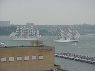 Two tall ships pass in the day