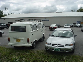 The bus and the Stratus wake up in front of the Autohaus in Ellsworth, Maine