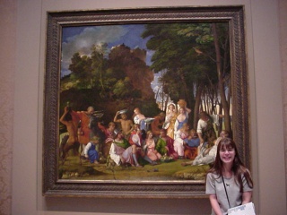 Theresa with a painting by Titian and Bellini, inside the West Wing of the National Gallery of Art