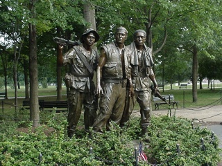 The Viet Nam Memorial statue, which was added later due to concerns the black wall was too abstract