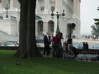A very important person being interviewed on the lawn of the Capital. He, however, would not get off of his cell phone for the interview...