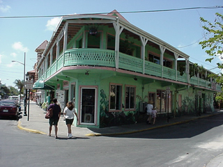 Not many towns could pull off a large pink and green corner building