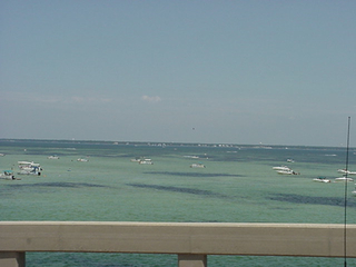 Folks fishing and playing in one of the many bays around Pensacola