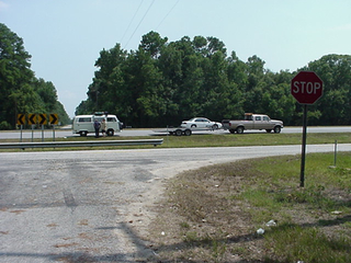 Our tow arrives. Not really much of a tow truck and a driver reminiscent of a few Texas Chainsaw Massacre characters