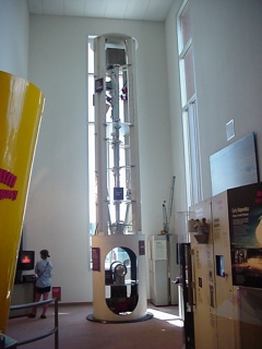 An example of the tubes they use to lower nuclear devices into holes in the desert to test fire them in. The round item in the bottom would be the bomb
