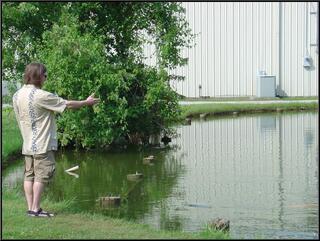 Brian, demonstrating goldfish and turtle feeding form