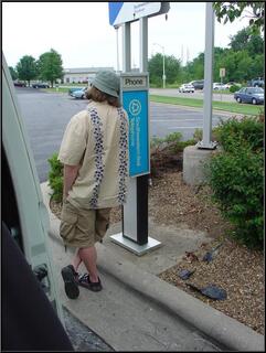 Brian, providing tech support for our new cell phone provider on a pay phone