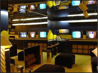 The television room's mirrored wall