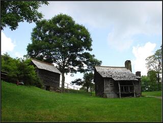 Old Appalachian cabin and out building. Formerly habitated by mountain people, now by Park Service interpreters
