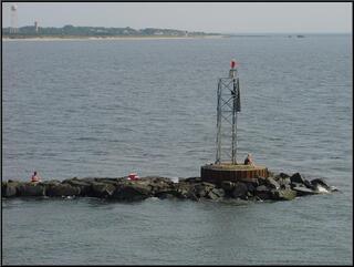 Folks hanging out on the end of the spit, Cape May in the background
