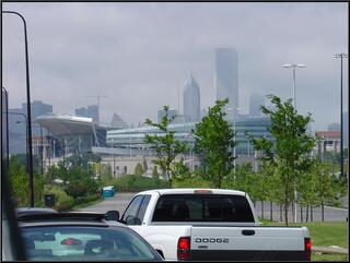Soldier Field in the foreground, clouds rolling in off of Lake Michigan and onto downtown Chicago in the background