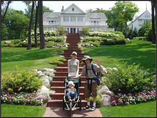 Joey and Anissa in front of their weekend home