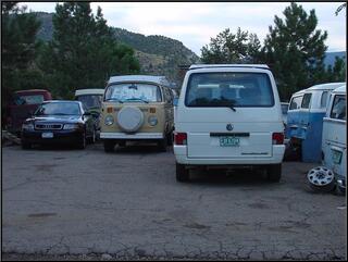 In the back lot of our new repair shop. A new Eurovan surrounded, more or less, by a bus graveyard