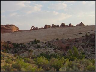 Delicate Arch on the left, from a distance