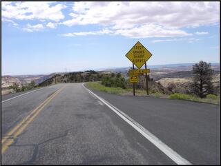 Another awesome stretch of road. This one runs down the top of a rock fin, and then off of the edge, in Escalante National Monument.