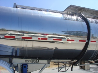 A stretch bus on a gas truck