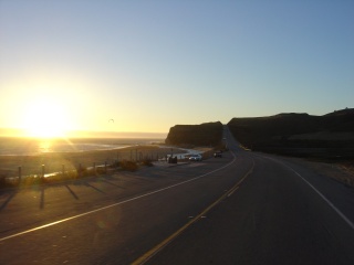 Sunset over Half Moon Bay and a paraglider