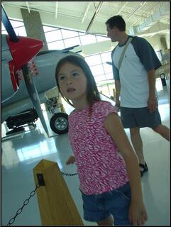 Brynn, looking a little overwhelmed by the tail section of the Spruce Goose