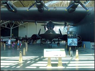 A Blackbird spy plane, tucked in under a much bigger relative