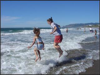 Theresa and Brynn jumping waves