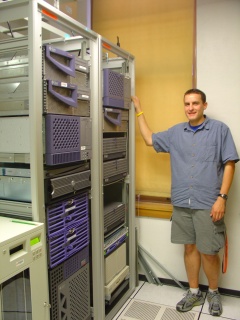 Todd and a rack of Sun hardware. Brian wants some.