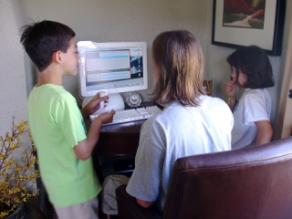 Brian is inside showing the kids how to create excellent music with Garage Band