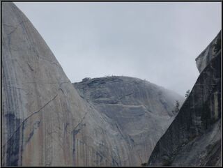Hikers lined up to take the cable steps to the top of half dome