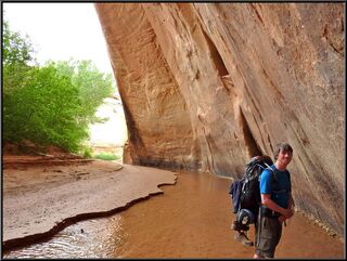 In the water, under a red cliff, spectacular