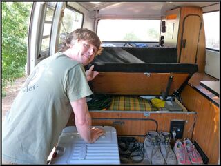 Brian tapping into the secret compartment that holds bus parts and tools