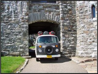 The bus coming through the tunnel at the castle
