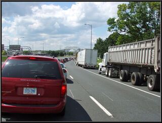 The traffic is backed up over the bridge and then some