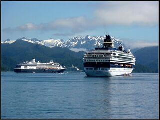Three cruise ships in the harbor, a fourth was around the corner