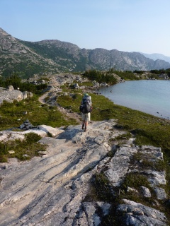 Theresa winds around an alpine pond above Long Lake