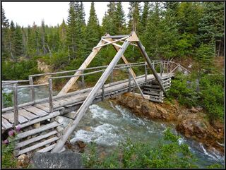 Funky bridge with stone cribs on the way out of camp