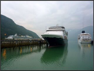 Three cruise ships dominating the harbor