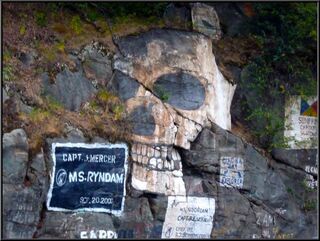 Soapy Smith's skull on the rocks above the harbor