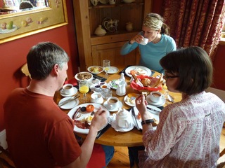 Brian with a large plate of breafast meats. The ladies behaving better.