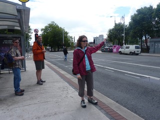 Cori, hailing a bus.