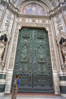 The doors of the Duomo, and Theresa for scale