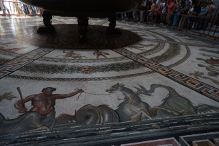 Mosaic on the floor of a room with a huge bowl