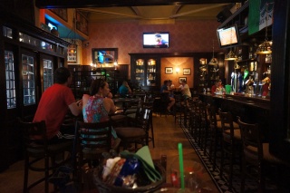 Refraining from potentially offensive jokes about holiness. An Irish Pub.