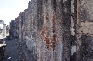 Columns were made of brick, covered in concrete, and then painted like marble