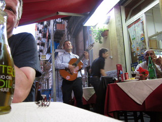 The smile is because the gentleman is really singing Volare