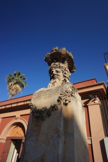 A bust with a fruit hat, outside the Botanical Gardens