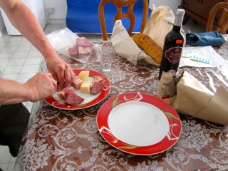 A snack from the market. Salami, ham, cheese and that mythical $2 bottle of wine