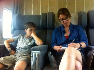 Cute. He actually swapped seats with his mom so he could watch her paint