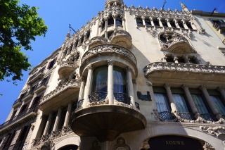 Done by the architect of the concert hall, Lluis Domenech. Now a Guess store