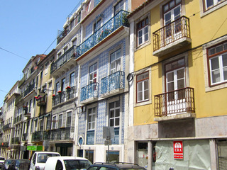 Past the yellow one, a couple of beautifully tiled buildings