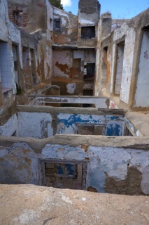 An abandoned building. Walls remain, but not much else